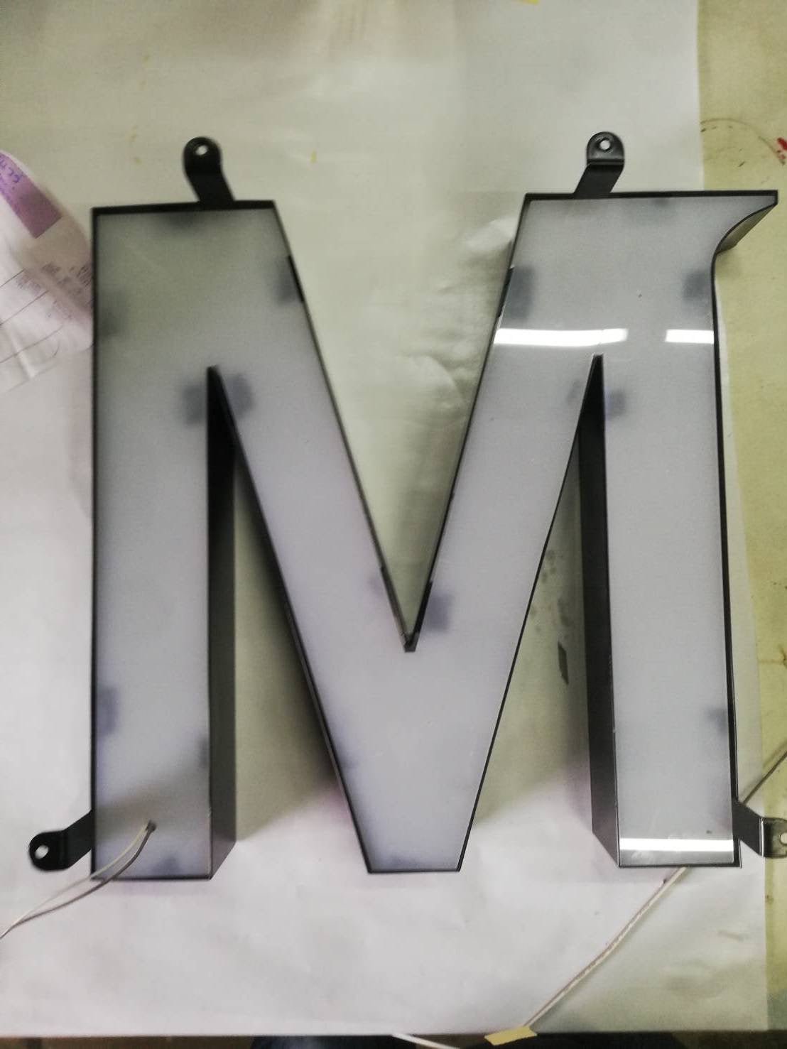Backlit letters Covered on the back of acrylic to prevent reflection of light beads